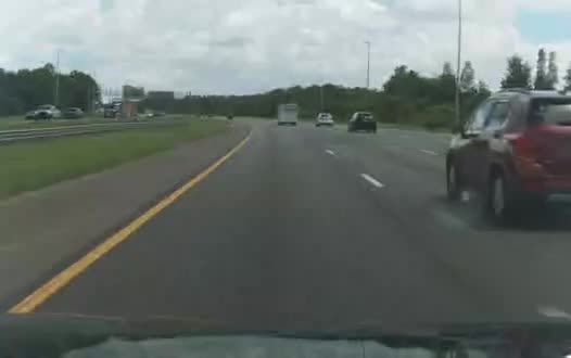Kia Niro EV forward-camera frame on an interstate