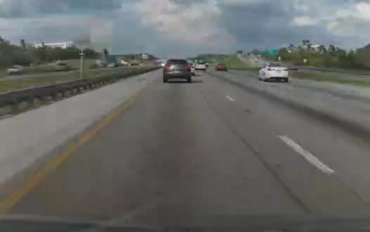 Volkswagen Tiguan forward-camera frame on an interstate