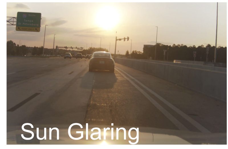 Low sun straight ahead on an interstate, washing out the lane lines