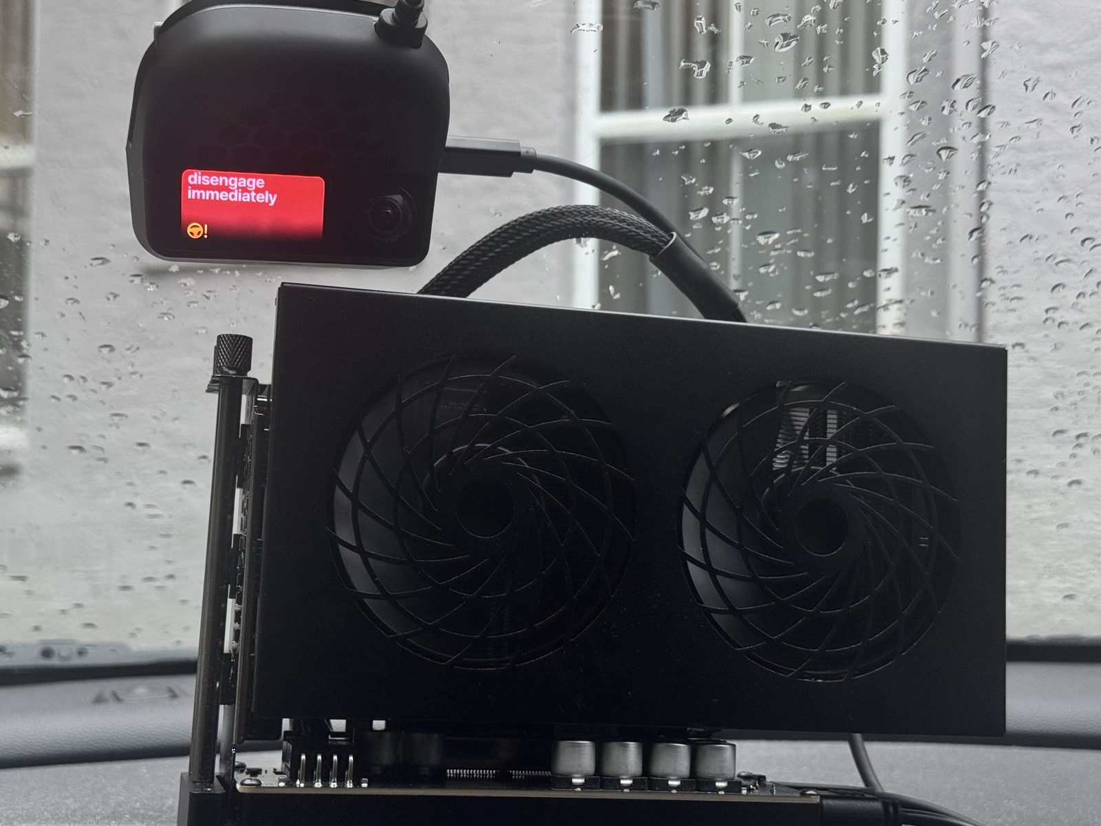 The device showing a 'disengage immediately' warning next to the GPU enclosure